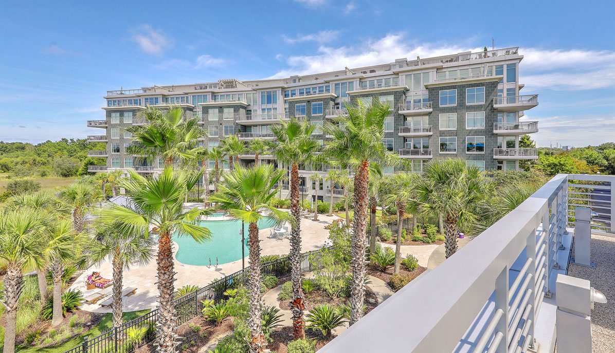 Tides Condominiums pool & palms