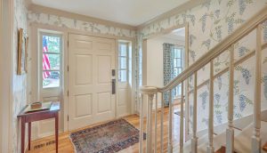 11 Ponce De Leon Avenue entry hall and staircase with statement wisteria wallpapper