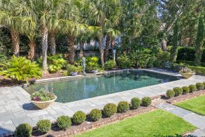 in ground pool surrounded by landscaping in a Charleston, SC home