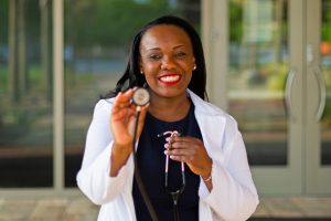 female healthcare worker holding stethoscope