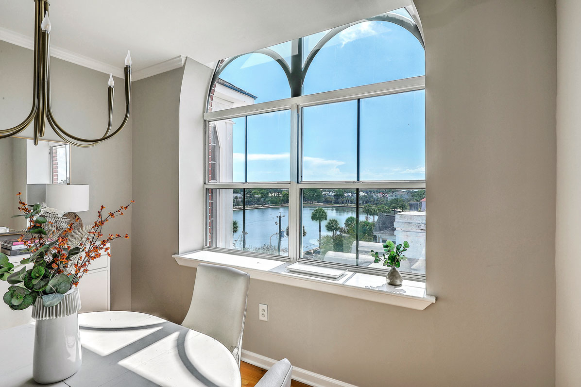 View of Colonial Lake from arched windows at 55 Ashley Avenue 23, Baker House in Charleston, SC