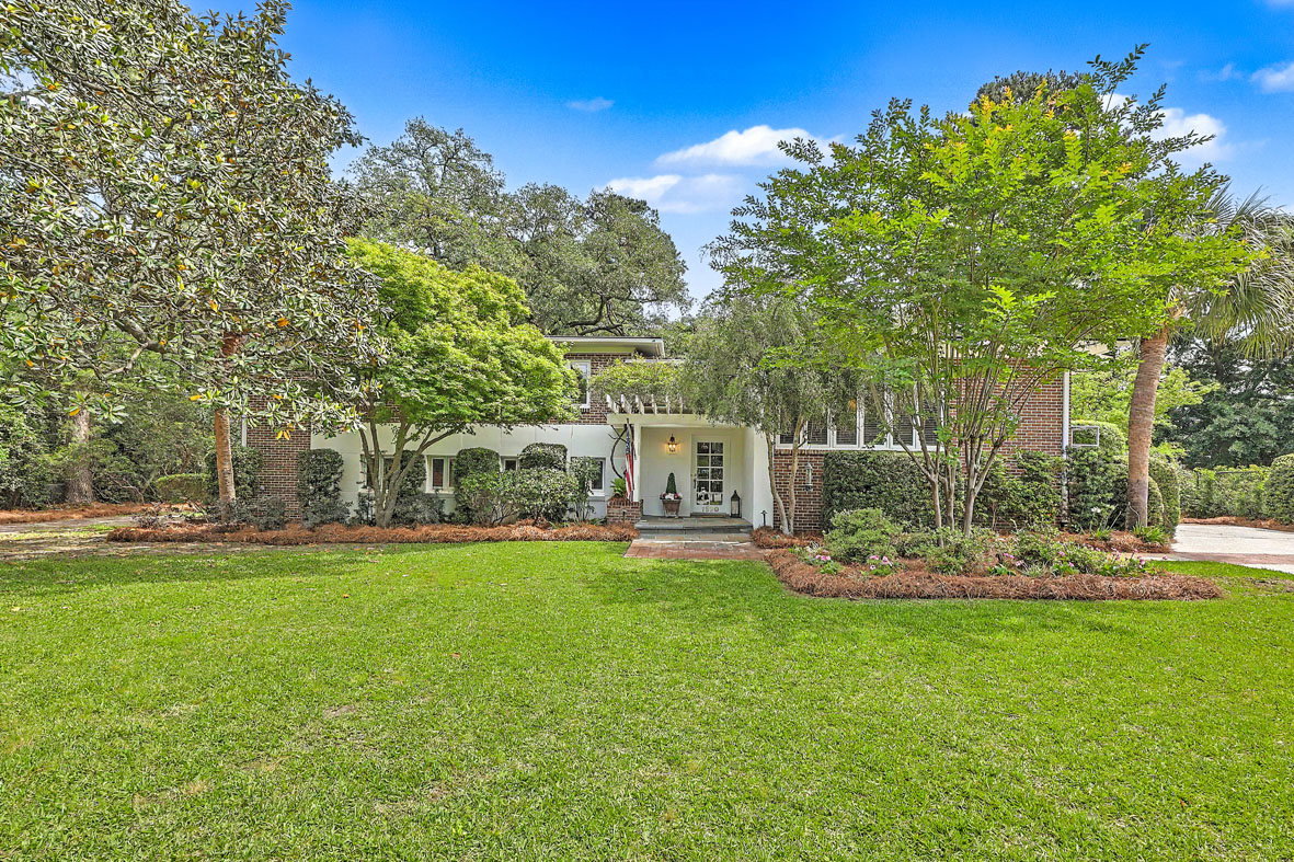 Brick split level home for sale on large, grassy lot with mature landscaping at 1520 Fairway Drive in Country Club II, James Island, SC